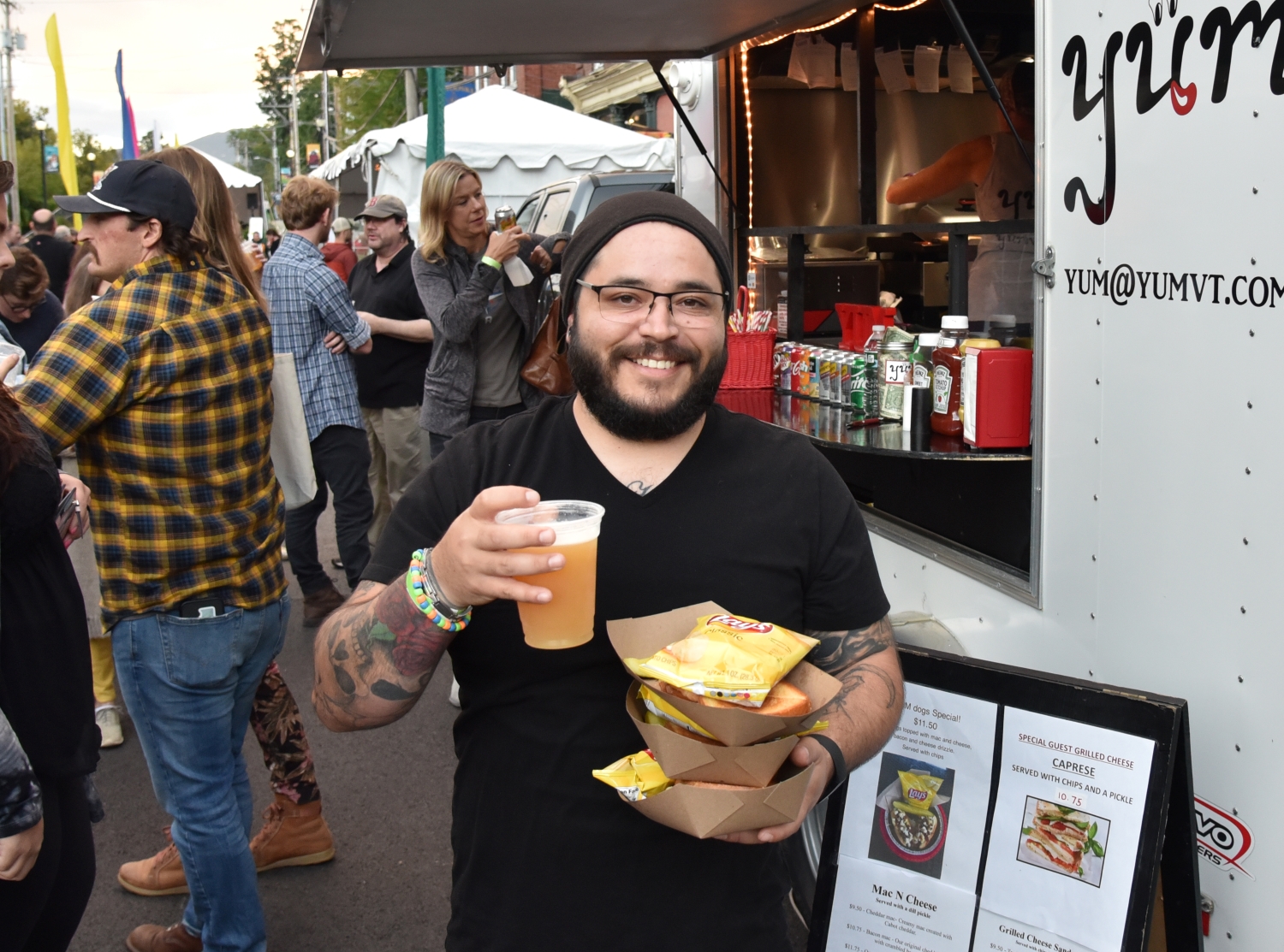 Happy person with beer and food